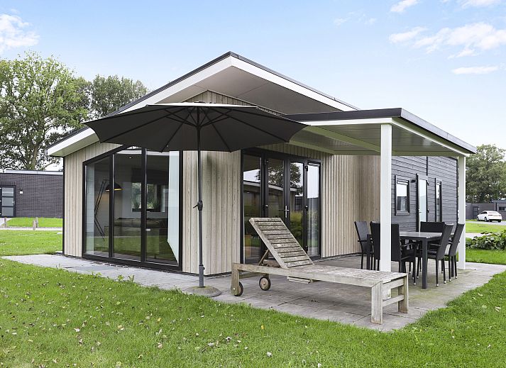 The Butterfly Farm vacation home in Kring van Dorth with green garden and modern architecture.