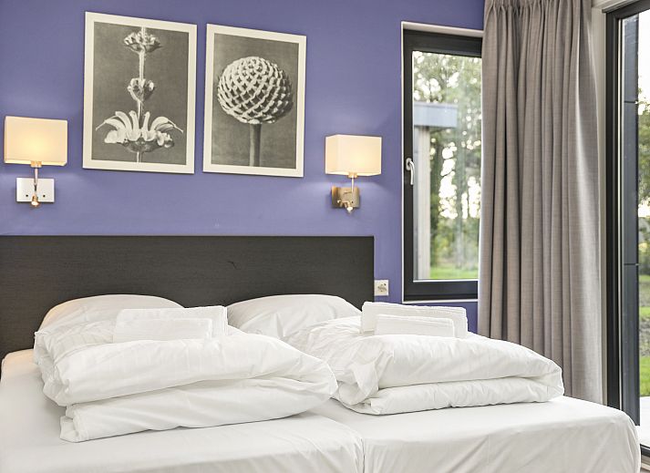 Stylish sitting area in The Butterflyhoeve 8-person house with modern decoration.