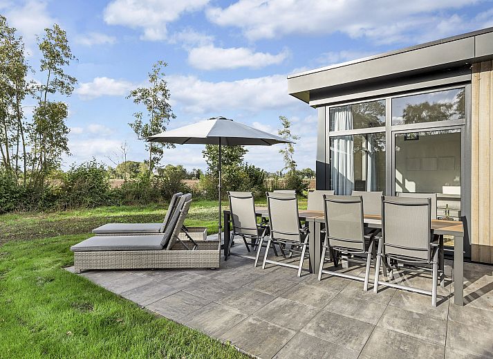 Stylish sitting area in The Butterflyhoeve 8-person house with modern decoration.