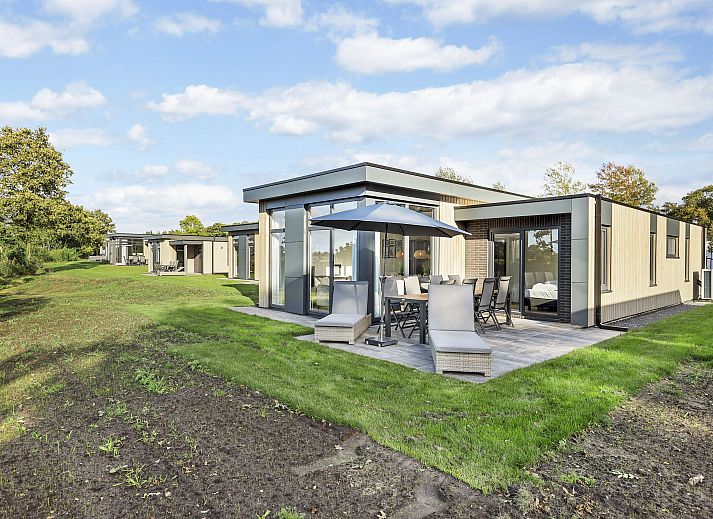 Stylish sitting area in The Butterflyhoeve 8-person house with modern decoration.