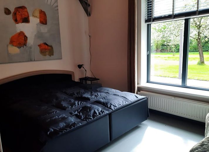 Cozy living room of cottage in Voorst, Achterhoek, overlooking the garden.