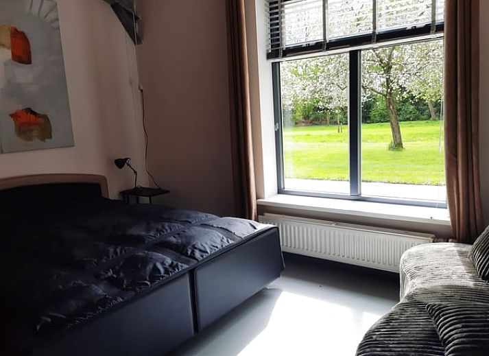 Cozy living room of cottage in Voorst, Achterhoek, overlooking the garden.
