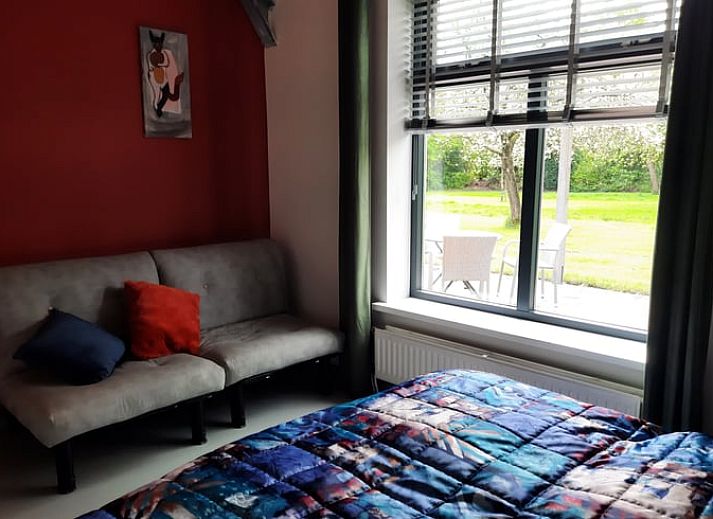 Cozy living room of cottage in Voorst, Achterhoek, overlooking the garden.