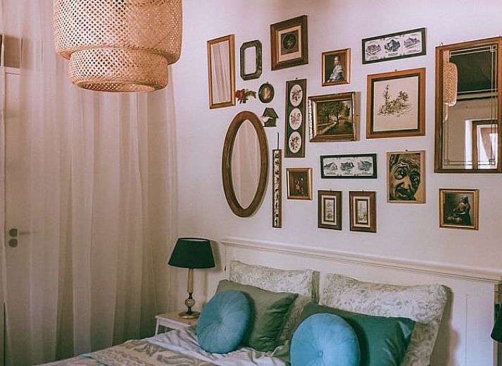 Cozy bedroom in Cottage in Voorst, Oude IJsselstreek, with decorative signs on the wall, located in Achterhoek, Gelderland.