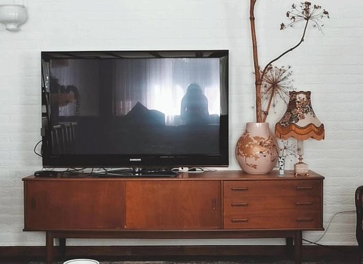 Attractive bedroom in Cottage in Voorst, Oude IJsselstreek, with artistic wall decorations and cozy furnishings, Achterhoek, Gelderland.