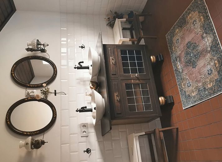 Attractive bedroom in cottage in Voorst, Oude IJsselstreek, Achterhoek, Gelderland, with stylish decor and comfortable beds.