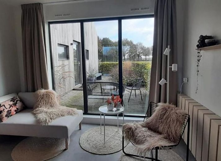 Vakantiehuis in Baak, Achterhoek, Gelderland, met moderne houten gevel en groene omgeving.