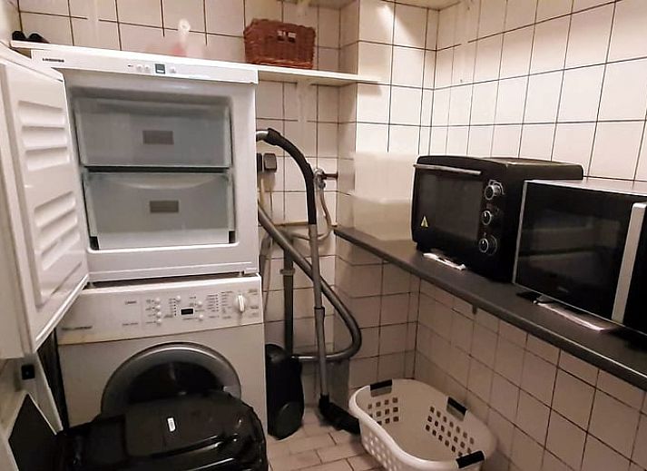Cozy living room in Holiday Home in Winterswijk Corle, Achterhoek, Gelderland, with comfortable seating area and modern furnishings.