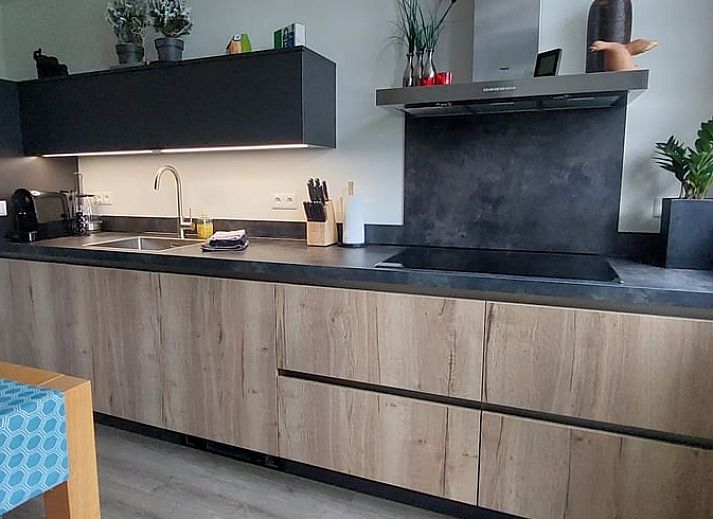 Cozy living room in Holiday home in Winterswijk Corle overlooking the green surroundings in Achterhoek, Gelderland.