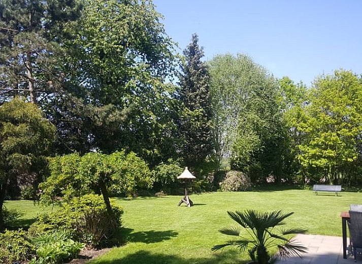 Modern living room with TV in Holiday home in Winterswijk Corle, perfect for relaxation in Achterhoek, Gelderland.