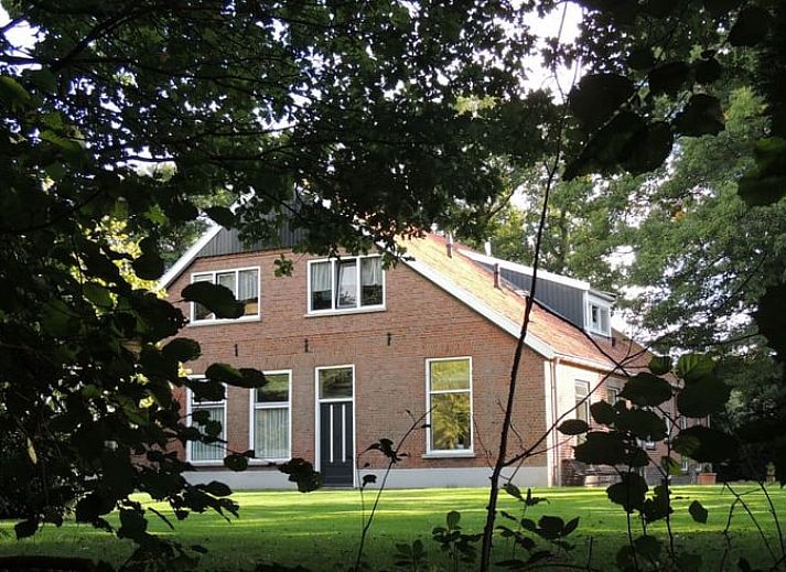 Dining and sitting area in Holiday home in Winterswijk Corle, overlooking the garden in Achterhoek, Gelderland.