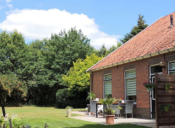 Dining and sitting area in Holiday home in Winterswijk Corle, overlooking the garden in Achterhoek, Gelderland.