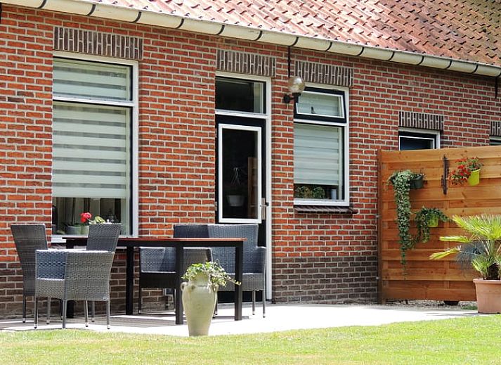 Dining and sitting area in Holiday home in Winterswijk Corle, overlooking the garden in Achterhoek, Gelderland.