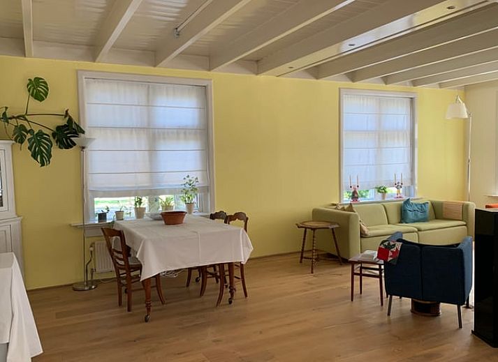 Vacation home in Corle, Winterswijk Corle, surrounded by green garden and blue sky in Achterhoek, Gelderland.