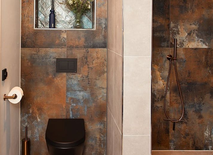 Cozy sitting area in cottage in Wilp-Achterhoek overlooking the green fields of Gelderland.