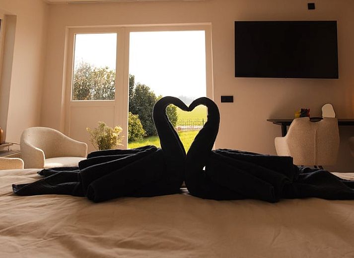Cozy sitting area in cottage in Wilp-Achterhoek overlooking the green fields of Gelderland.