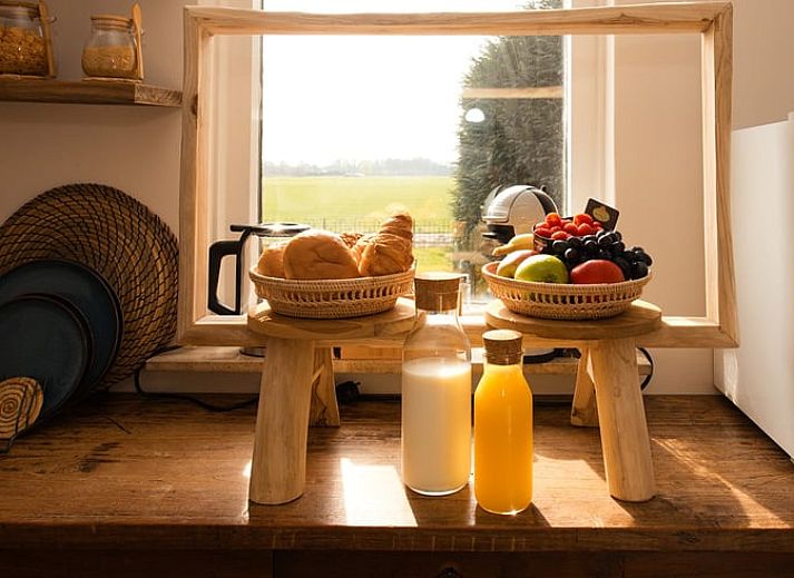 Romantic bedroom in Holiday Home in Wilp-Achterhoek with towel swans on the bed.