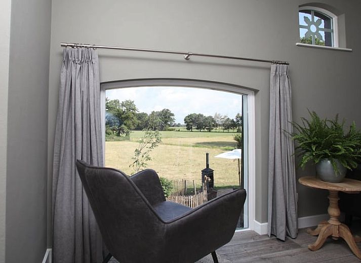 Vakantiehuis in Zieuwent, Achterhoek, Gelderland met charmant terras en groene omgeving voor een ontspannen verblijf.