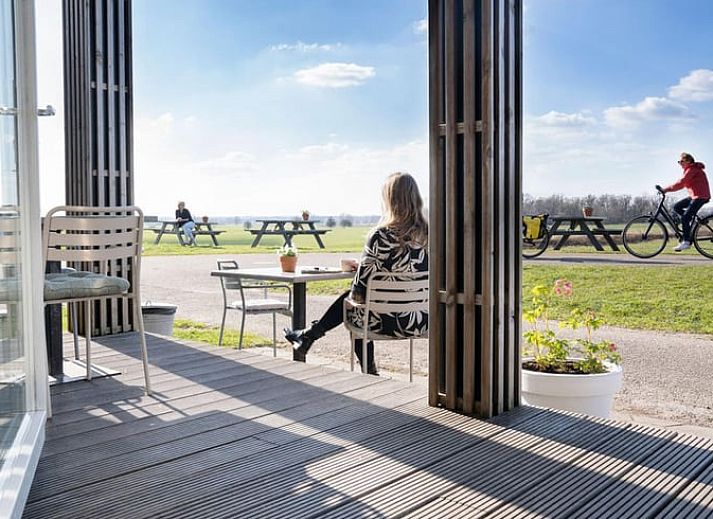 Cozy living room in Cottage in Bronkhorst, vacation home in Gelderse Valley with modern interior and natural light.