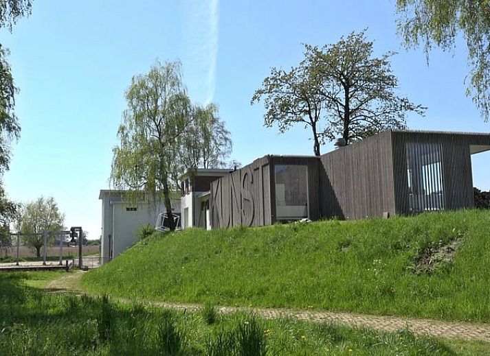 Cozy living room in Cottage in Bronkhorst, vacation home in Gelderse Valley with modern interior and natural light.