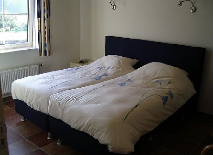 Gemuetliches Wohnzimmer im Ferienhaus Foxheuvel, Didam, mit Kamin und bequemer Sitzecke.