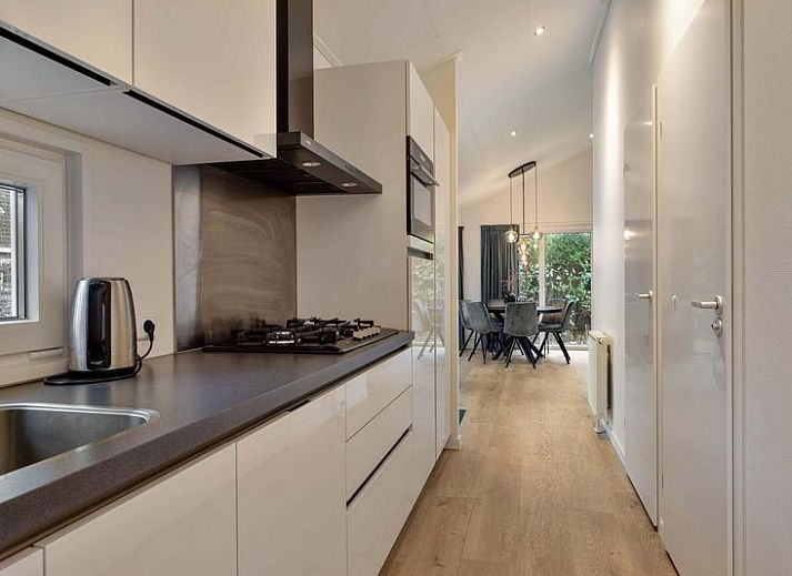 Cozy family enjoys the hot tub at Ferox 5 person Wellness in Ede, Veluwe.