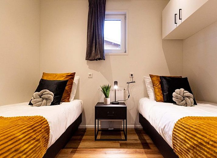 Module Wood 4 persons vacation home in Ede, Veluwe with modern wooden exterior and terrace in natural surroundings.