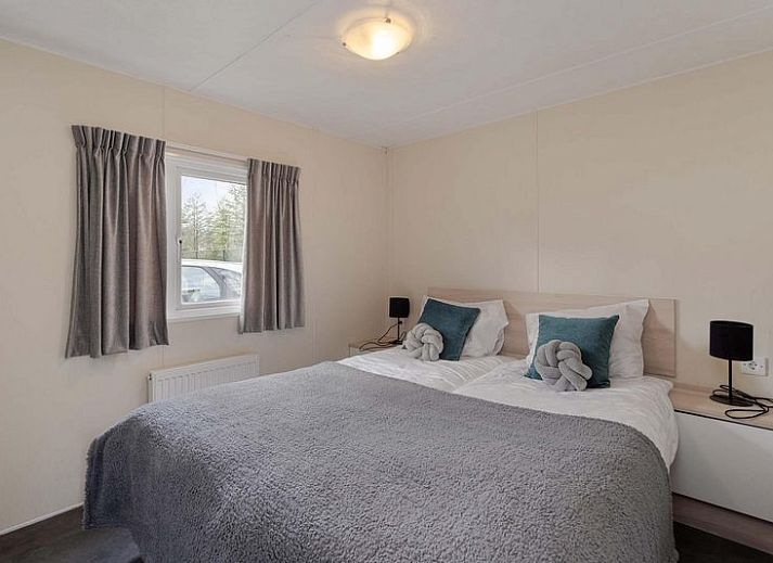 Holiday home 4 persons in Ede, Veluwe, Gelderland with views of pond and surrounding nature.