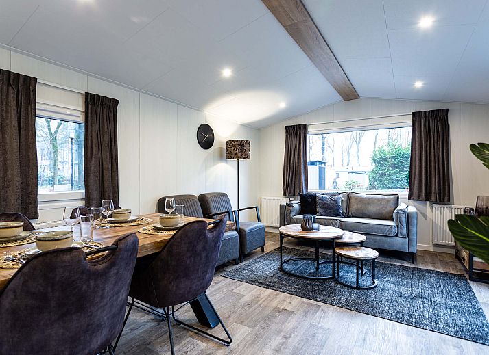 Stylish kitchen in Luna vacation home, Ede, Veluwe, with wooden cabinets and appliances.