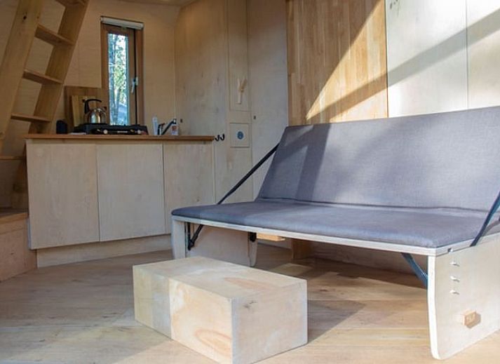 Ferienhaus in Ede, Veluwe, mit rustikaler Holzausstattung und natuerlicher Umgebung.