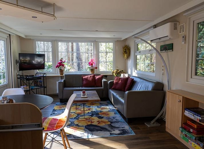 Cozy living room in Holiday Home in Emst, Veluwe, overlooking nature.