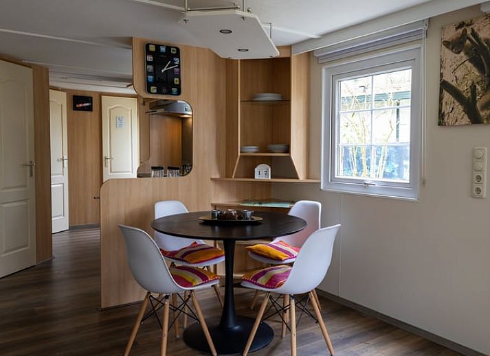 Attractive sitting area in Holiday Home in Emst, Veluwe, with colorful rug.