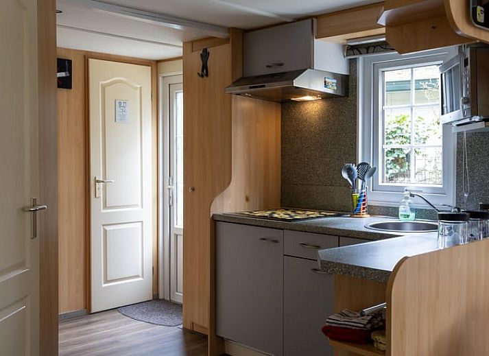 Attractive sitting area in Holiday Home in Emst, Veluwe, with colorful rug.