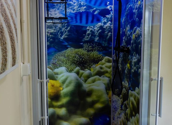 Comfortable seating area in Holiday home in Emst, Gelderland, overlooking the garden.