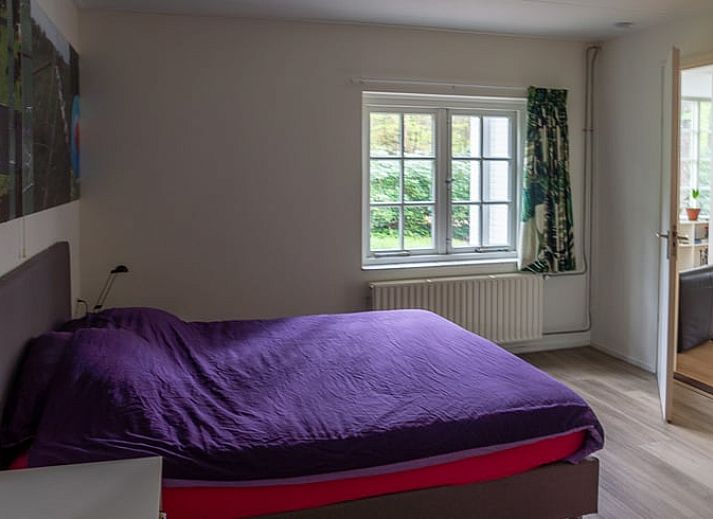 Vacation home in Emst, Veluwe, Gelderland surrounded by green nature and rustic charm, ideal for a relaxing stay.