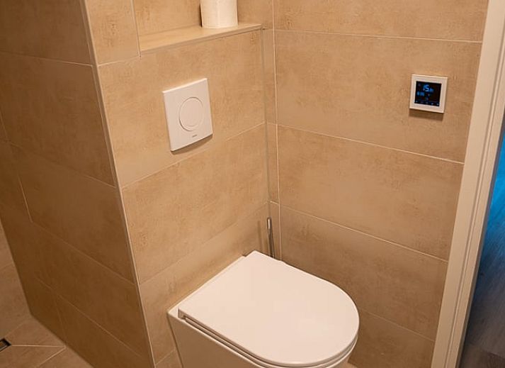 Cozy living room of Holiday home in Emst, Veluwe, with modern decor and lots of natural light in Gelderland.