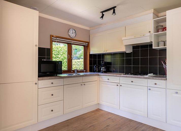 Terrace of Veluwe Lodge vacation home in Harderwijk, Veluwe surrounded by trees