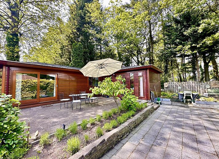 Terrace with seating at Cozy Lodge vacation home in Harderwijk, Veluwe, Gelderland.