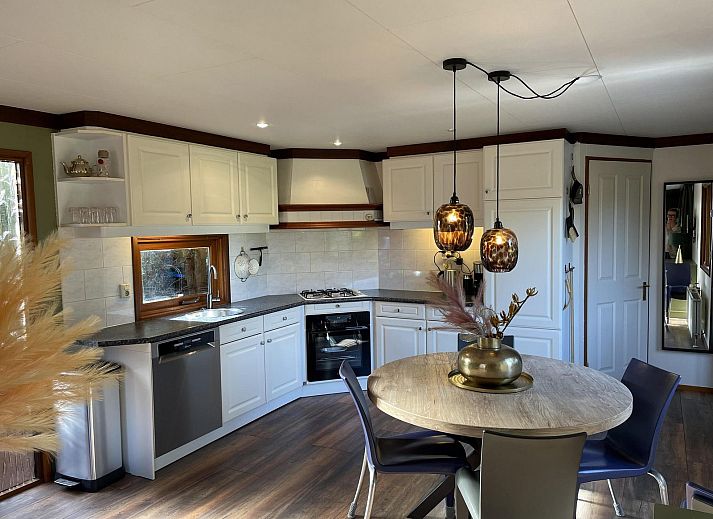 Terrace with seating at Cozy Lodge vacation home in Harderwijk, Veluwe, Gelderland.