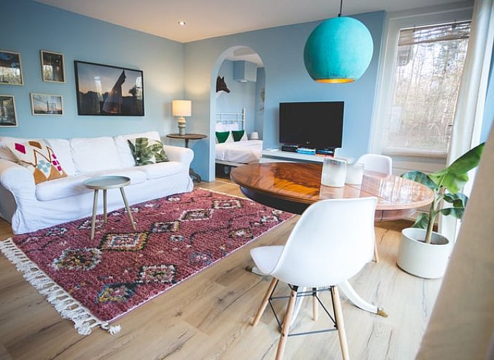 Vakantiehuisje in Hoenderloo gelegen in de Veluwe, omgeven door weelderige natuur en rustgevende bossen.