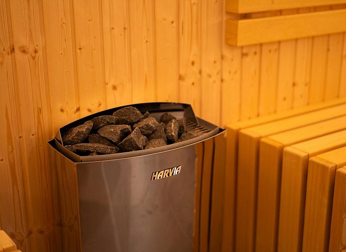 Terrace with parasol at Group Accommodation Specht, a vacation home in Hoenderloo, Veluwe surrounded by greenery.