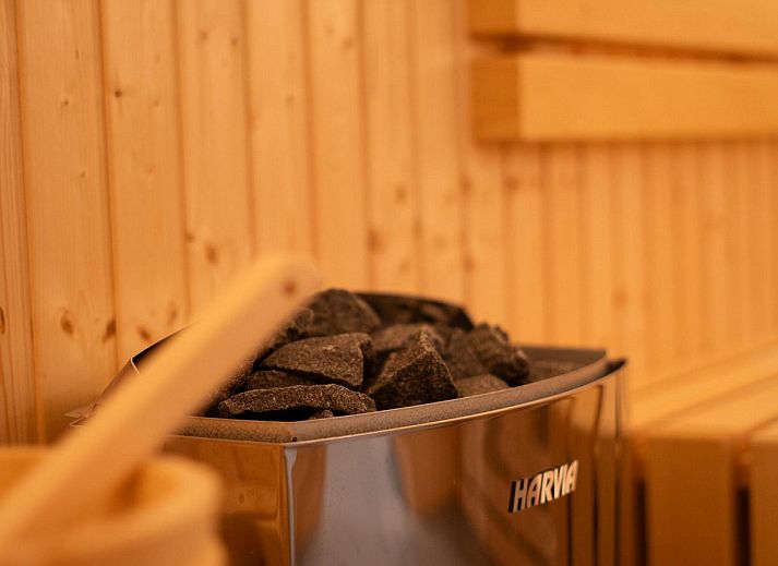 Terrace with parasol at Group Accommodation Specht, a vacation home in Hoenderloo, Veluwe surrounded by greenery.
