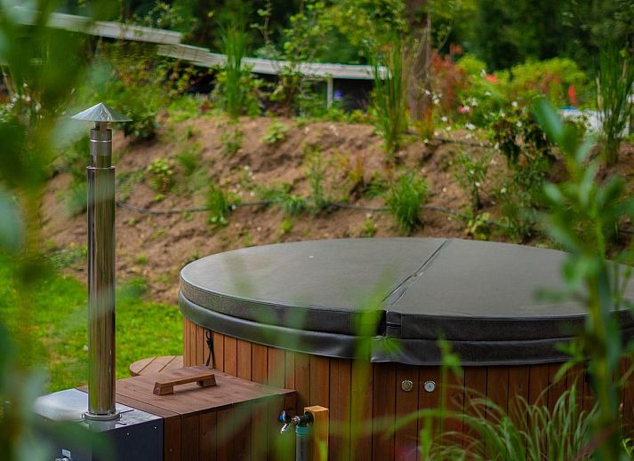 Outdoor area of Group Accommodation Specht in Hoenderloo, Veluwe. Vacation home with spacious seating area in Gelderland.
