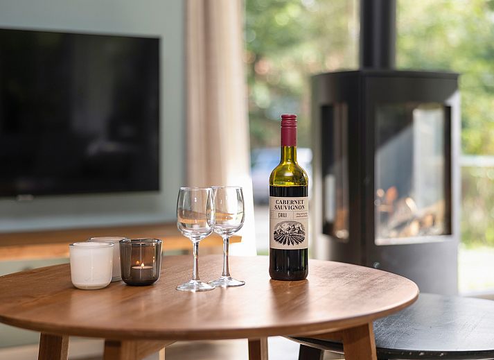 Dining room in Miggelenberg bungalow, Hoenderloo, Veluwe, Gelderland, with large wooden table.