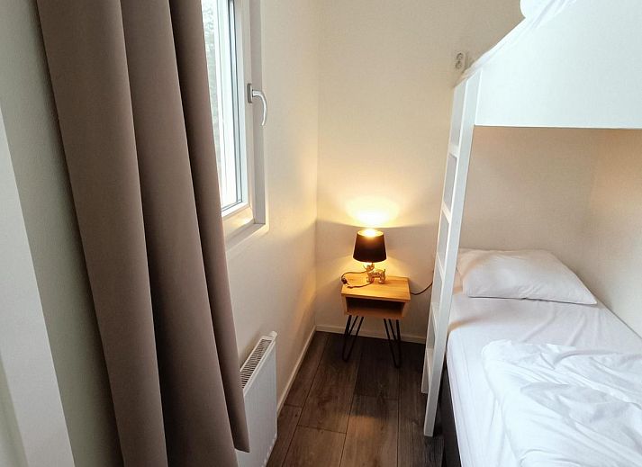 Terrace at Holiday home Heidehoeve comfort in Hoenderloo, ideal for outdoor dining on the Veluwe, Gelderland.