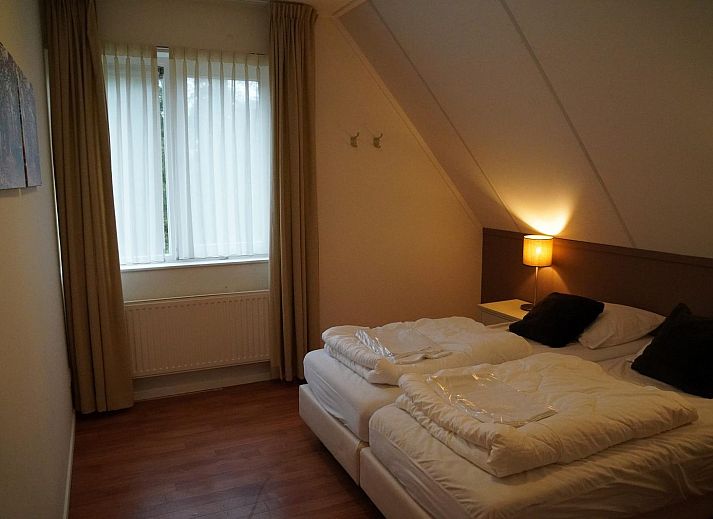 Gruppenunterkunft Douglas, ein attraktives Ferienhaus in Hoenderloo, Veluwe, umgeben von gruener Natur und ruhiger Waldumgebung.