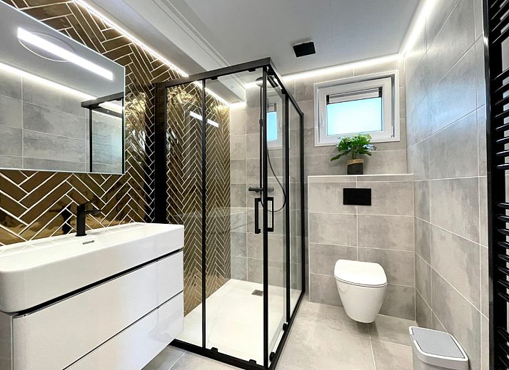 Gezellige zithoek in Vakantiewoning Boszicht Luxe, vakantiehuis in Hoenderloo, Veluwe.