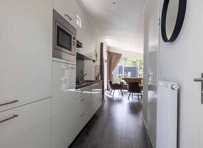 Detached house in Hoenderloo in the Veluwe, Gelderland, with modern exterior and green surroundings.