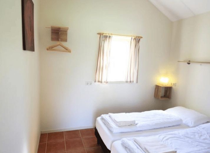 Picturesque setting of Holiday Home in Terwolde, Veluwe, with green gardens and an inviting walking trail.