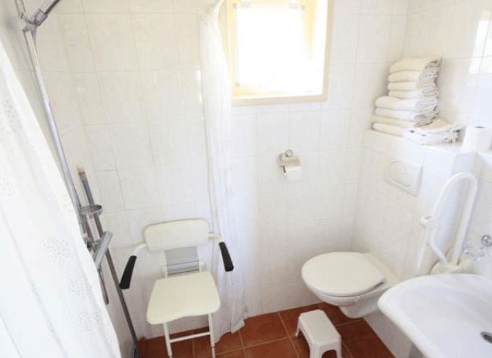 Bright dining area in Holiday home in Terwolde, Veluwe, Gelderland, with garden views and modern amenities.